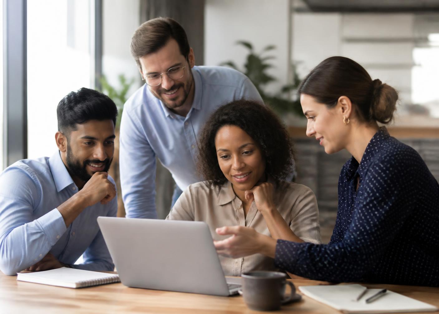 A small team reviewing a short security awareness lesson together on a laptop